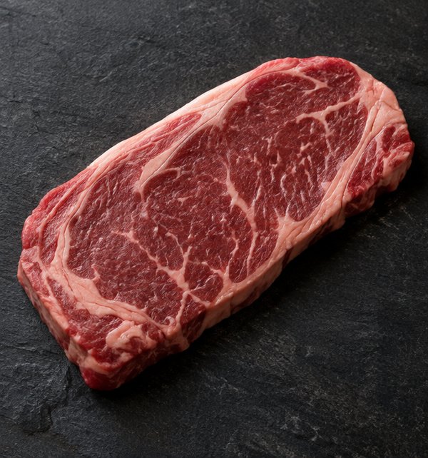 Wagyu marbling swatch showing sparse fat distribution, marble score 3 to 4